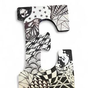 White and black wooden letter